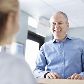 Man visiting his dental office. 