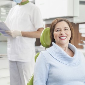 Woman smiling in the dental chair