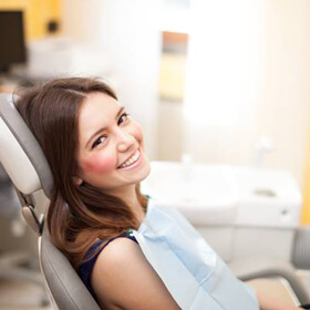 Smiling woman in dental chair