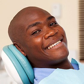 Smiling man in dental chair