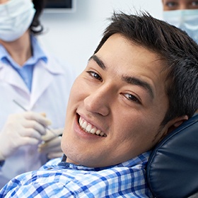 Smiling man in dental chair