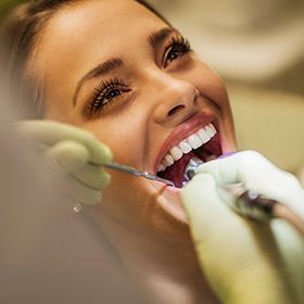 Woman receiving dental exam