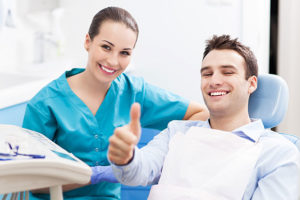 dentist with male patient