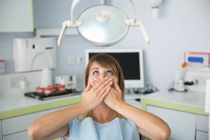 dental patient covering mouth