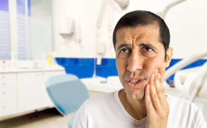 dental patient holding cheek